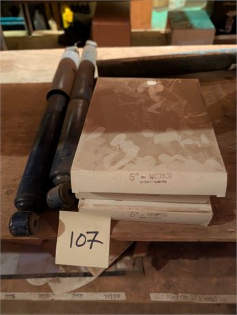 Lot 107-Shocks, and Pipe Clamps
